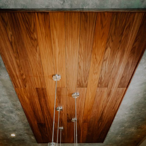 Walnut acoustic wood planks featured on a kitchen ceiling.